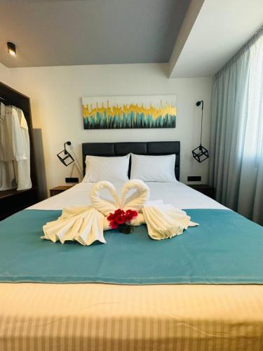 Postel nebo postele na pokoji v ubytování Joy Apartments