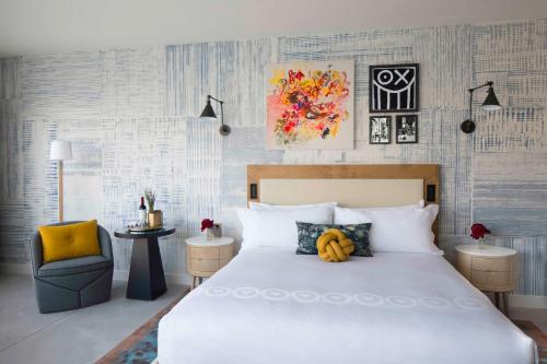 a bedroom with a bed with a banana on it at Hotel 50 Bowery, part of JdV by Hyatt in New York