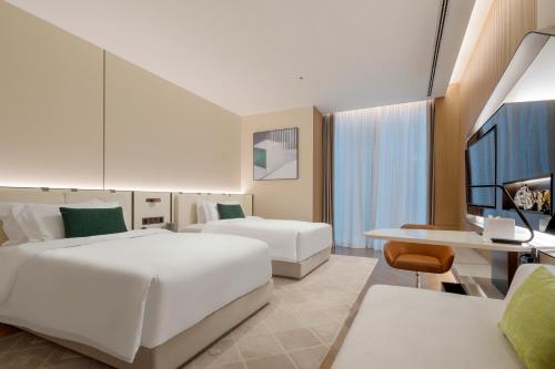Postel nebo postele na pokoji v ubytování Shenzhen Ayearn Hotel