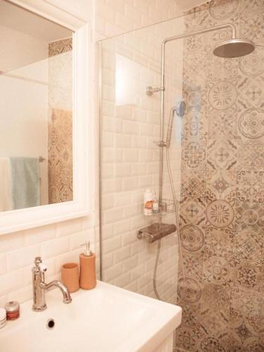 a bathroom with a shower with a sink and a shower at Casa di Campara in Neum