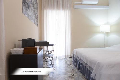 Postel nebo postele na pokoji v ubytování Soggiorno Lucano