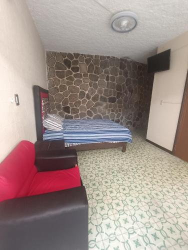 Ένα ή περισσότερα κρεβάτια σε δωμάτιο στο Hostal y hotel familiar china poblanan
