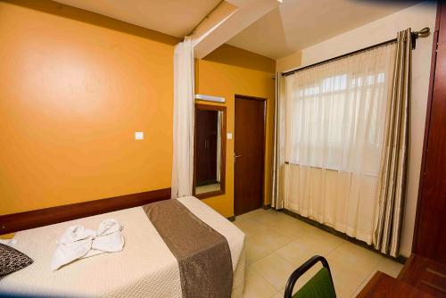 Postel nebo postele na pokoji v ubytování Acacia Resort Wote-Makueni by Nest & Nomad