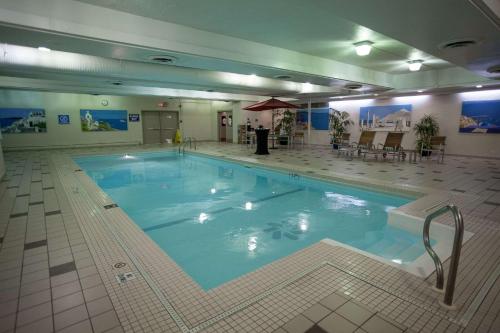 a large swimming pool in a hotel room at Edmonton Hotel & Convention Center Edmonton in Edmonton