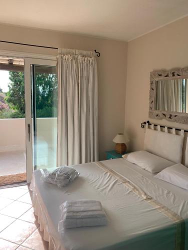 Postel nebo postele na pokoji v ubytování Villa Caroline - Notteri a Villasimius