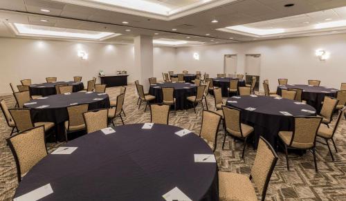 a conference room with black tables and chairs at Radisson Hotel Salt Lake City Downtown in Salt Lake City