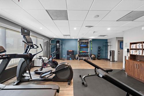 a gym with two treadmills and two exercise bikes at Hampton Inn Los Angeles Airport in Los Angeles