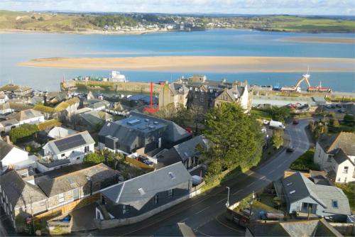 an aerial view of a town next to the water at Stylish estuary view apartment in Padstow