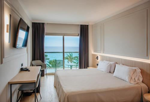 Postel nebo postele na pokoji v ubytování Hotel Miramar