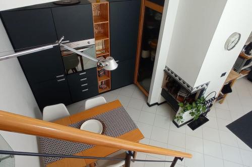 a room with a desk and a table and chairs at attico spettacolare vista mare in Camogli