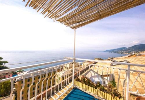 a view of the ocean from the balcony of a building at attico spettacolare vista mare in Camogli
