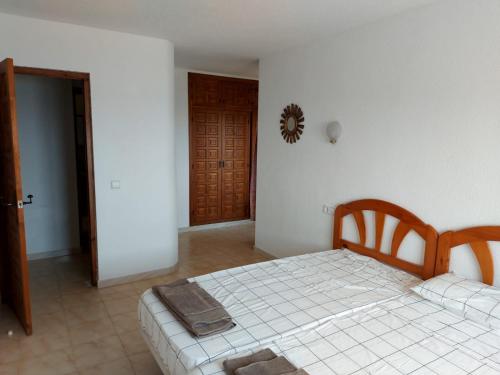 a bedroom with a bed and a room with a door at Amazing view villa in Calpe