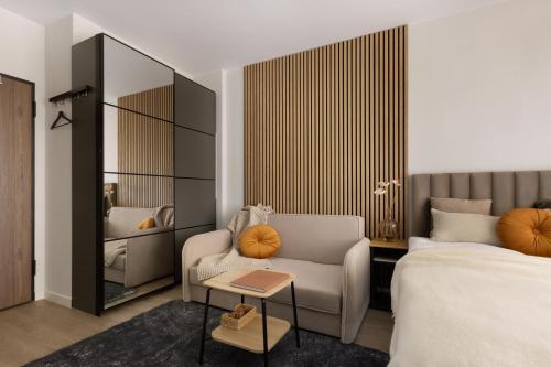 Ένα ή περισσότερα κρεβάτια σε δωμάτιο στο Scala Apartamenty by Moderna Profit- Łąkowa 60E z parkingiem
