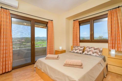 Postel nebo postele na pokoji v ubytování Tasos Apartment