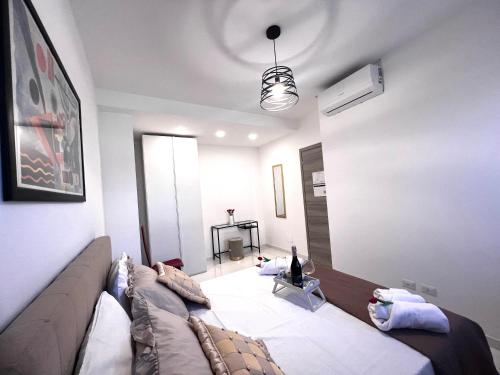 a living room with a couch in a room at ROMA AIRPORT SKY Apartments in Fiumicino
