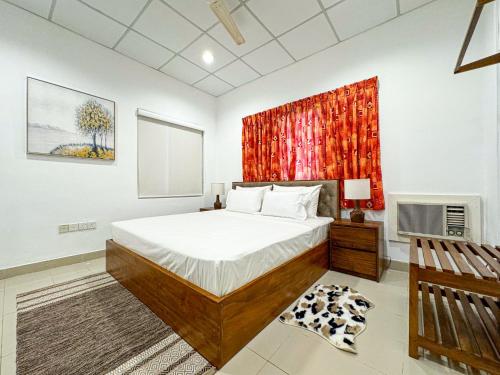 a bedroom with a large bed and a window at Allure CMB by Allure Leisure in Nugegoda