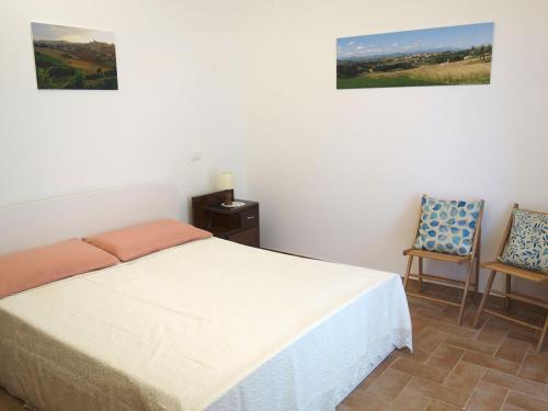 Postel nebo postele na pokoji v ubytování Il mulino di Augusto e Marianna