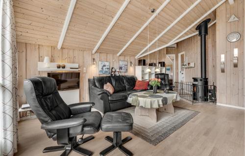 a living room with a couch and chairs and a table at Holiday Home Birkemose In Dnmk in Skovby