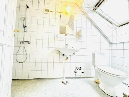 a bathroom with a toilet and a sink at aday - Gorgeous 1 bedroom apartment in Randers in Randers