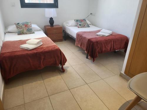 Кровать или кровати в номере Roses Casc Antic SL Sabater 2