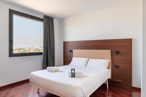 A bed or beds in a room at B&B Hotel Sassuolo