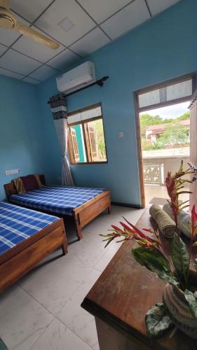 Postel nebo postele na pokoji v ubytování Thomasha Homestay & Tuk Tuk Tour