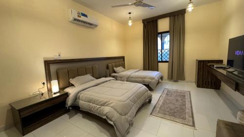 Ένα ή περισσότερα κρεβάτια σε δωμάτιο στο Bait Al Hakem Guest Rooms