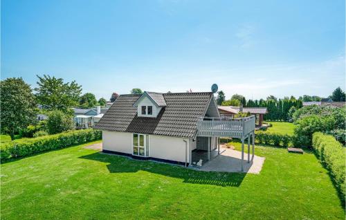 an aerial view of a house with a large yard at Holiday Home Strandvænget Bogense Denm in Bogense