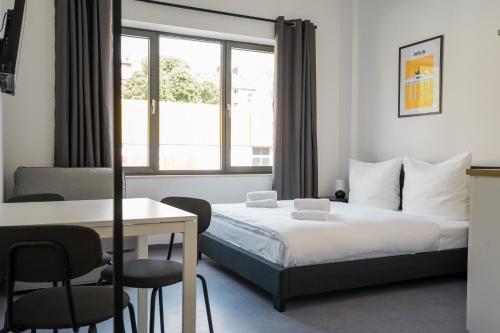 Ένα ή περισσότερα κρεβάτια σε δωμάτιο στο Apartmenthaus Berlin Neukölln