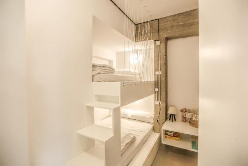 a room with two bunk beds in it at Convent-Βand Αpartment in Kalabaka