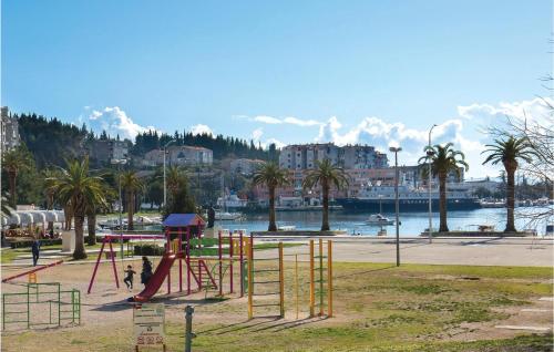a playground in a park next to a body of water at Two-Bedroom Apartment In Ploce in Ploče