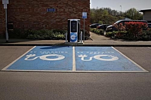 a parking lot with a handicap sign on the street at Holiday Inn Express Nuneaton by IHG in Nuneaton