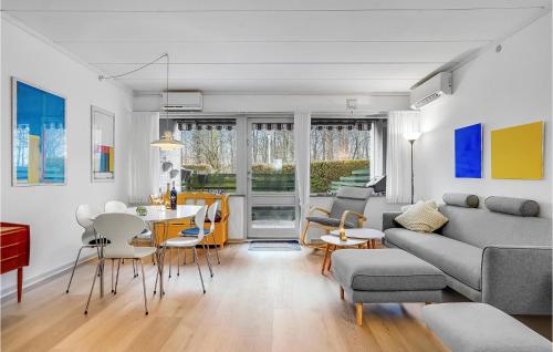 a living room with a couch and a table at Stunning Home In Haderslev With Wifi in Haderslev
