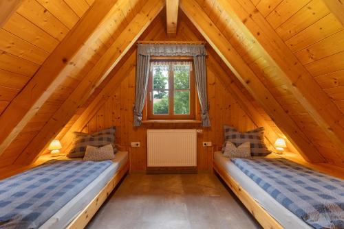 Ένα ή περισσότερα κρεβάτια σε δωμάτιο στο Hexenhäuschen