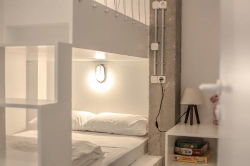 a bedroom with a bunk bed in a room at Convent-Βand Αpartment in Kalabaka