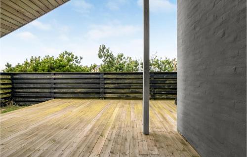 a room with a wooden floor and a wall at Amazing Home In Thisted With Sauna in Torsted