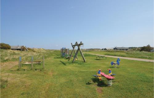 a group of children playing in a park at Holiday Home Svenstibakkevej Frøstrup Iv in Lild Strand