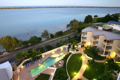 an aerial view of a resort with a swimming pool at Moorings Beach Resort in Caloundra