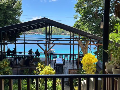 a restaurant with a view of the water at Olala Bungalows and Restaurant in Sabong