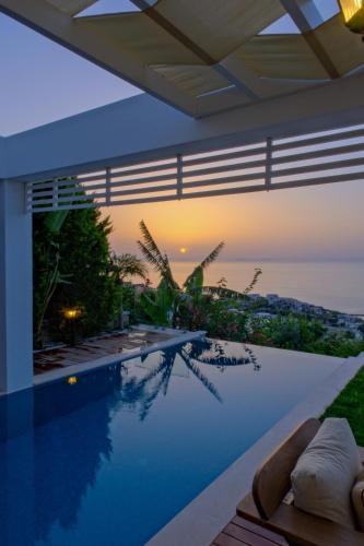 a swimming pool with a view of the ocean at Villa Aleph-Kiralık Müstakil havuzlu lüx villa in Bodrum City
