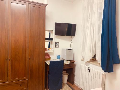 TV a/nebo společenská místnost v ubytování Camera Singola Matrimoniale Verona