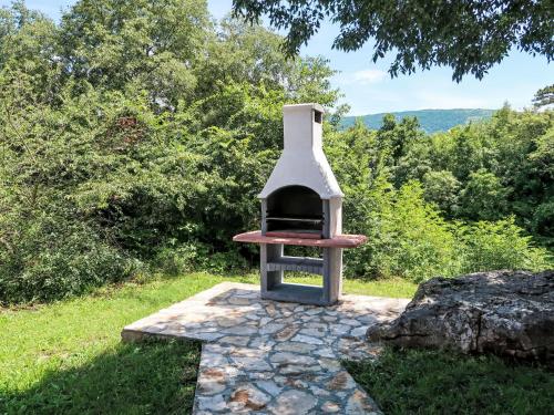 a small oven sitting on top of a rock at Holiday Home Diana by Interhome in Kršan