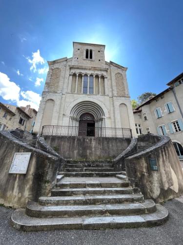 a building with stairs in front of a building at Maison La vieille vigne in Dieulefit