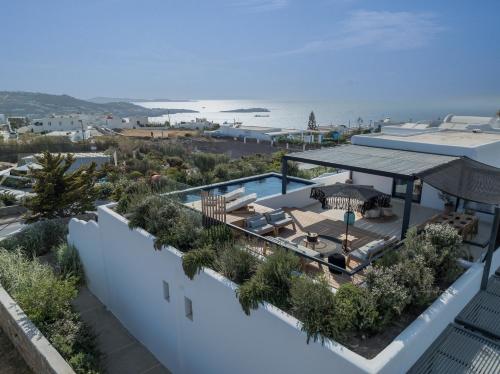 an aerial view of a building with a swimming pool at Asty Mykonos Hotel & Spa - World of One Hotel Group in Mýkonos City