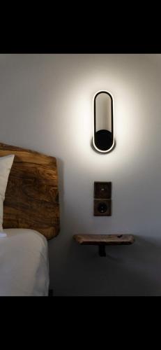 a bedroom with a bed and a mirror on the wall at Villa Elena with jacuzzi in Kyllini