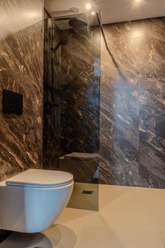 a bathroom with a toilet and a shower at Hotel 83 in Amsterdam