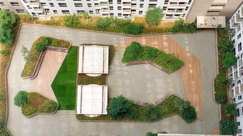 an aerial view of a park in a city at Great Choice and Homey 2BR at Tokyo Riverside PIK 2 Apartment By Travelio in Rawalembang
