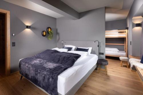 Voodi või voodid majutusasutuse Schöneben Appartementen Top 2 toas