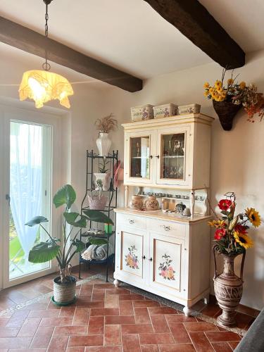 a kitchen with a white cabinet with a sink at Relaxing farmhouse in San Marino