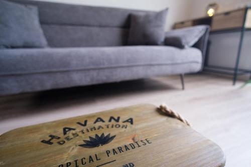 a living room with a couch and a surfboard at GuestReady - A lovely refuge in Madeira in Machico